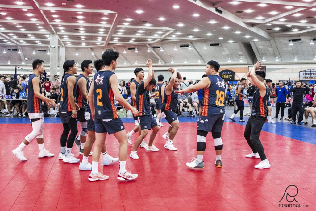 Men's volleyball team celebrating