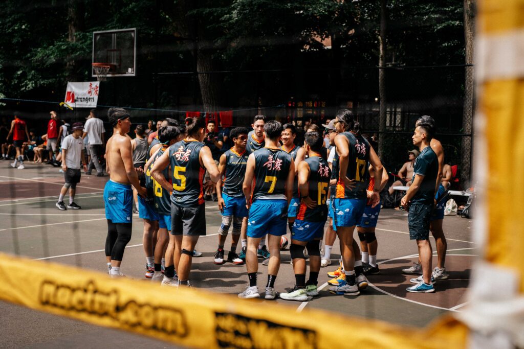 Men's volleyball team in a huddle